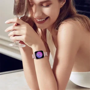 Model wearing a luxury Milanese metal apple watch band in starlight.